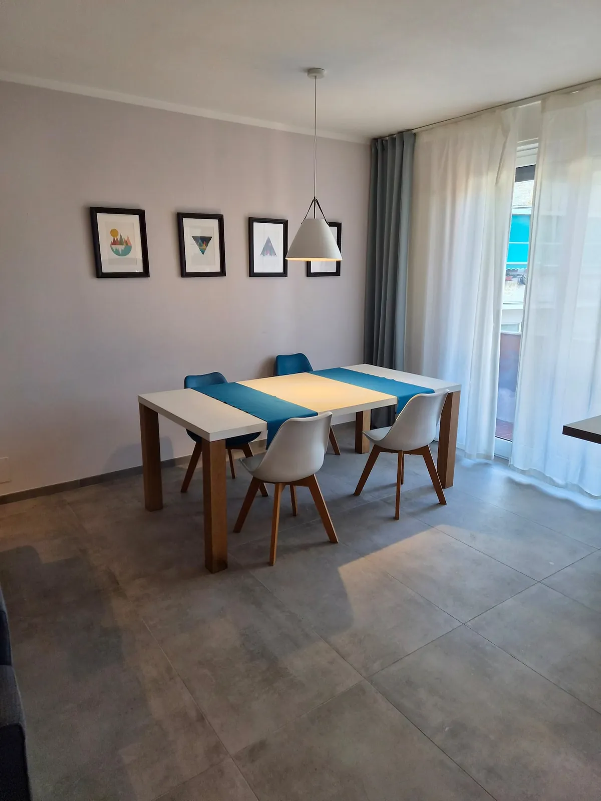 The table for six by the window, handy as a desk